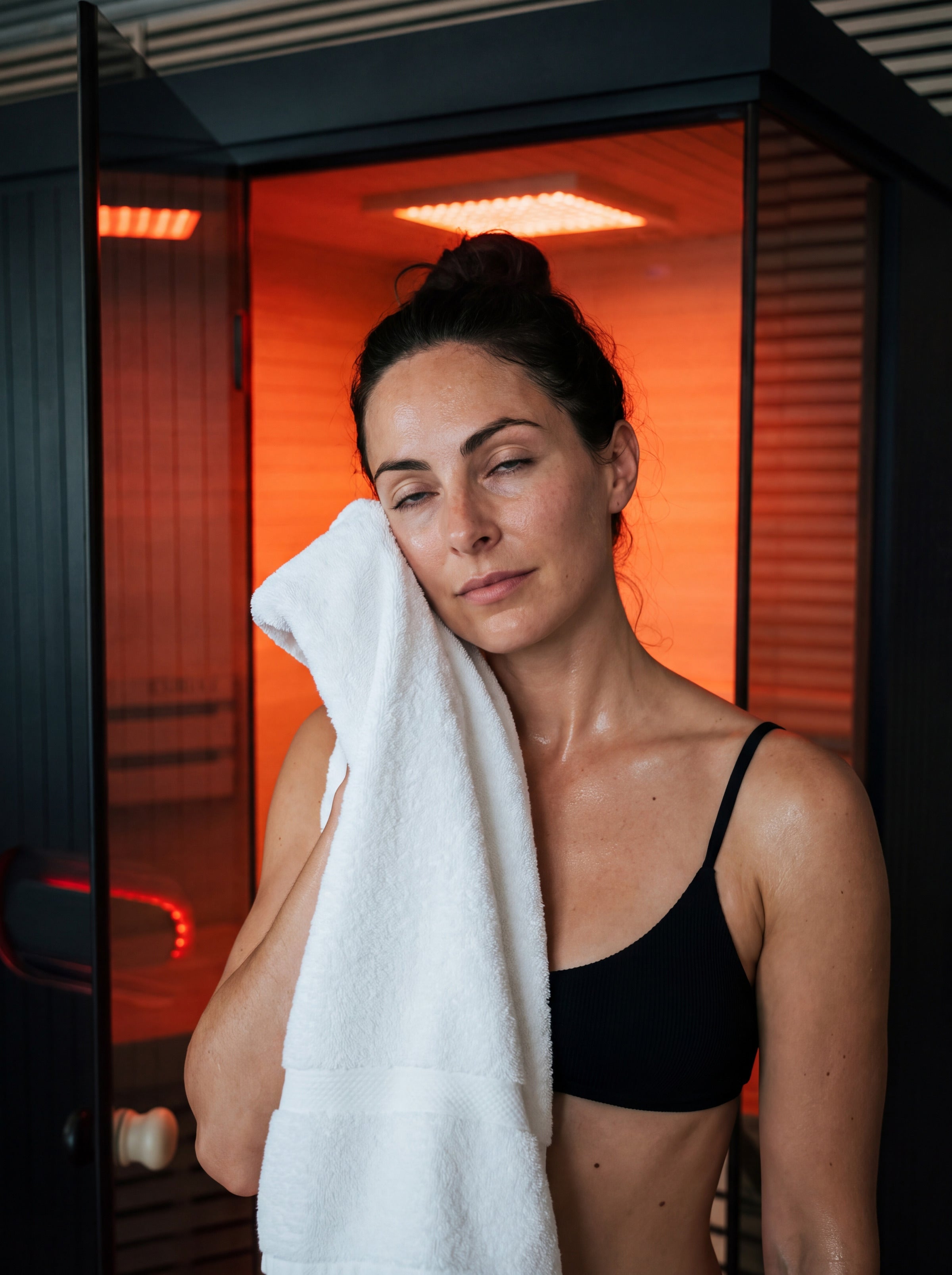 Cooling off outside the Forge Indoor, wiping her face with a white towel
