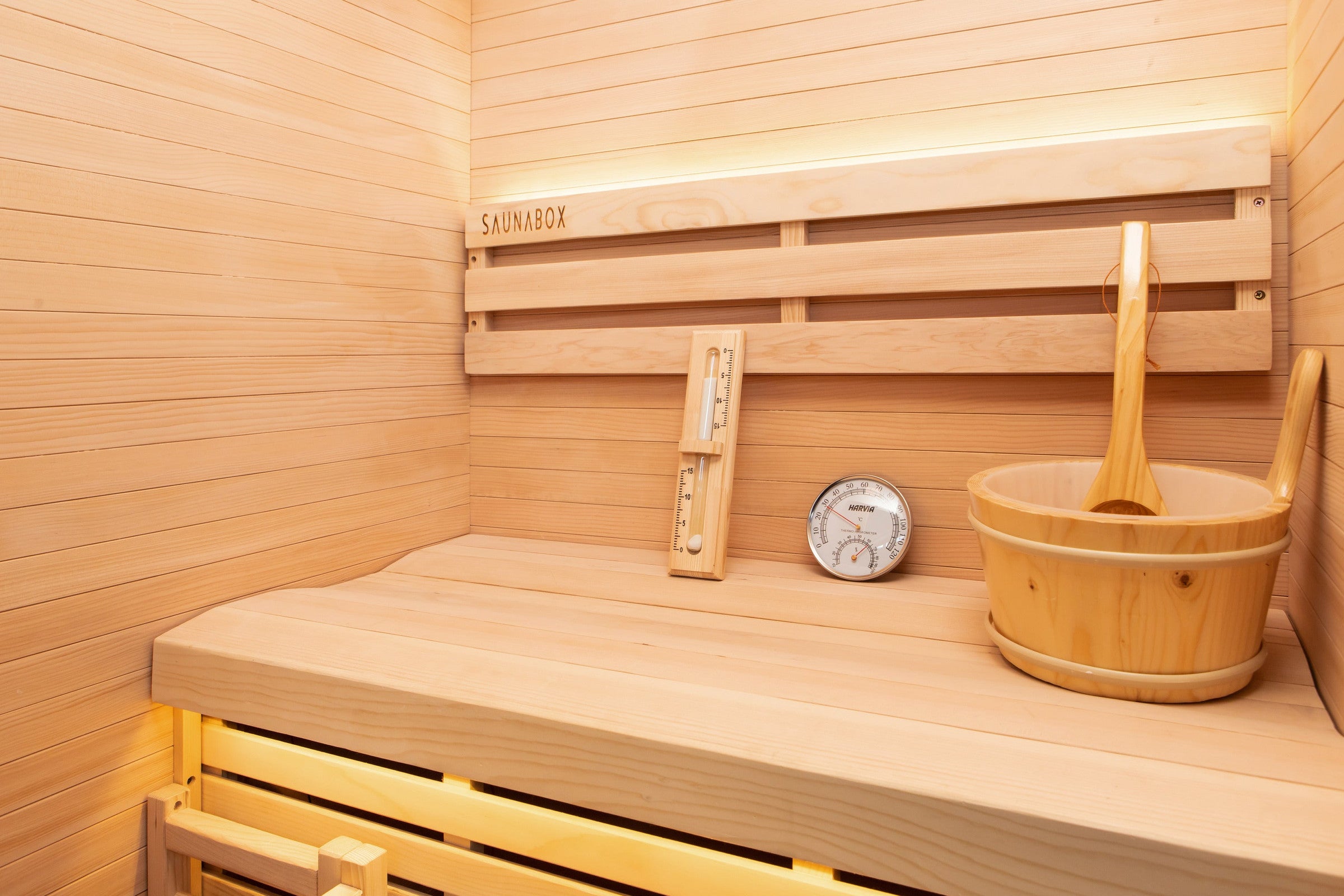 Inside the Forge Indoor: the Hemlock bench and backrest with the wooden bucket and ladle, thermometer and sand timer
